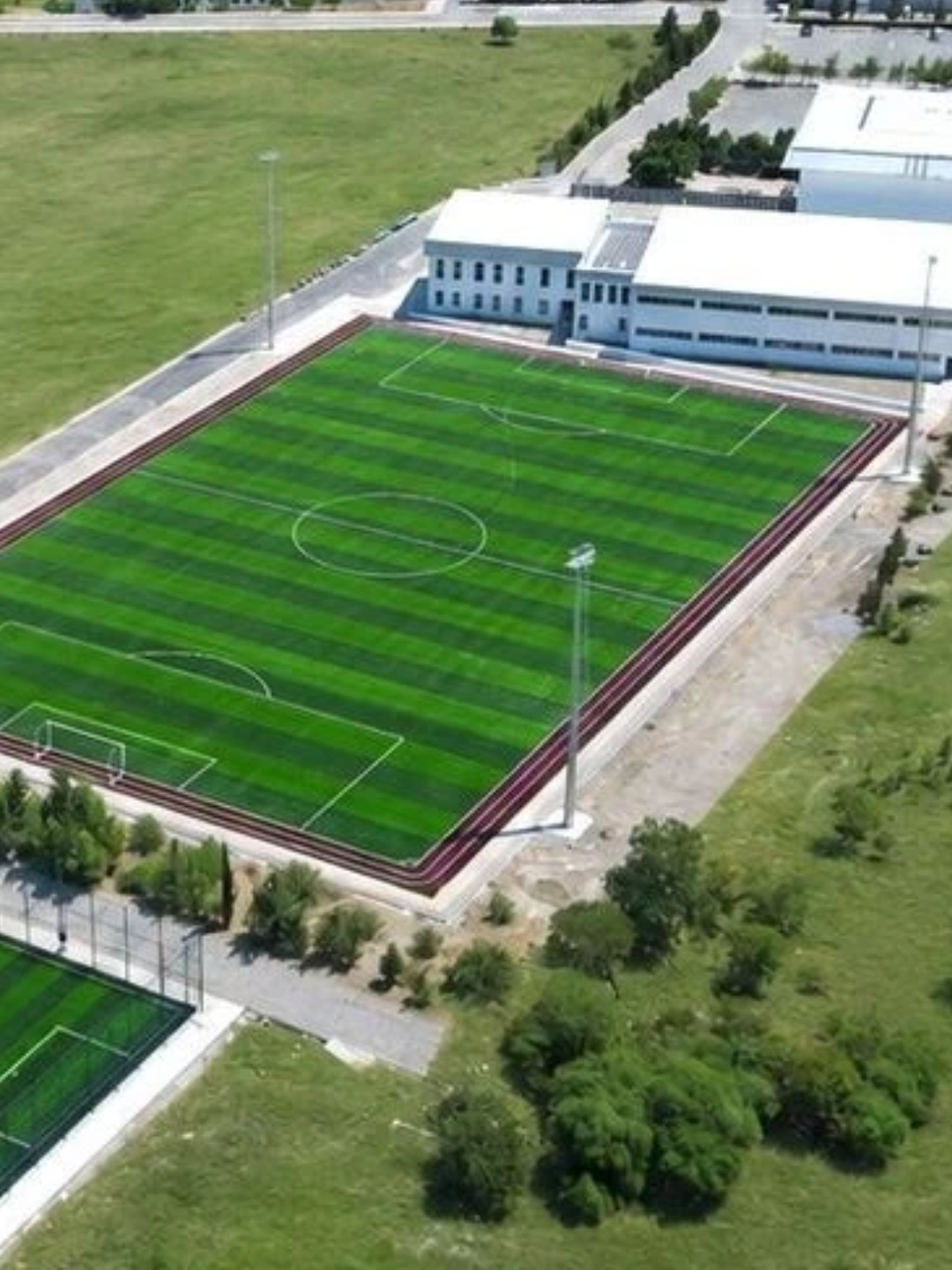 Aerial view of a football field and sports facilities